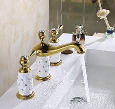 3 holes bathroom sink faucet in gold finish