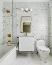 Small contemporary bathroom in other with white cabinets, white tile, ceramic tile, white walls, terrazzo floors, wood benchtops, an open shower how are you going to fit it all in when your floorplan is limited? Small Spaces Can Be Glam Too Modern Bathroom Tile Small Bathroom Latest Bathroom Designs