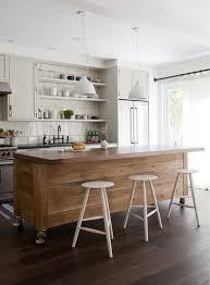 The kitchen island is further emphasized from the rest of the kitchen by placing a modern crystal chandelier right above it, which also adds a more dramatic lighting effect to the space. Simo Design Puts Large Kitchen Island On Wheels