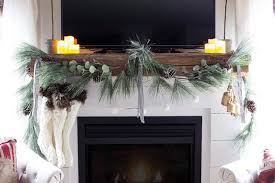 a mantel with a tv above it for