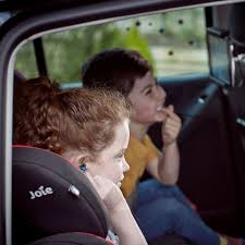 Child Sit In The Front Seat Of A Car