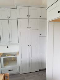installing hidden walk in pantry cabinets