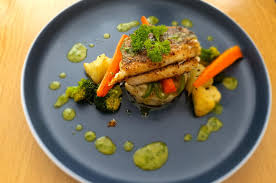 pan fried hake with veggies and herb