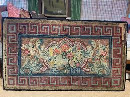 19th century hooked rug with greek key