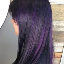 Woman in black outfit with purple hair. Purple Highlights On Dark Hair Is The Latest Instagram Trend