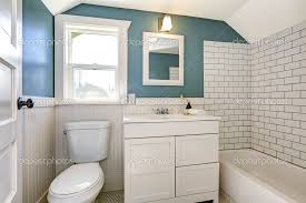 Aqua Bathroom With White Tile Wall Trim
