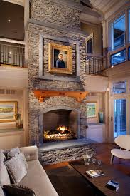 Large Stacked Stone Fireplace With Wood