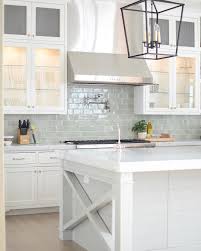 Bright White Kitchen With Pale Blue Subway Tile Backsplash