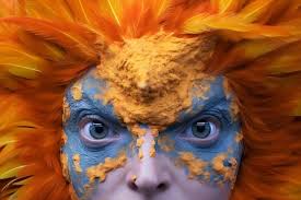 a person with orange and blue face paint