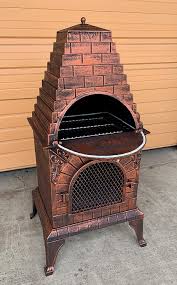 With chiminea fire pit, you can heat your patio and backyard in a modernized manner. Amazon Com Deeco Dm 0039 Ia C Aztec Allure Cast Iron Pizza Oven Chiminea Garden Outdoor