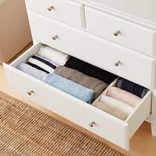 A tall dresser with a narrow footprint can create as much storage as possible in a tight space. Dresser Drawer Organizer 4 Dream Drawer Organizers The Container Store