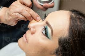 makeup artist applying foundation using