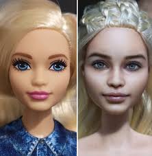 artist repaints dolls in a more