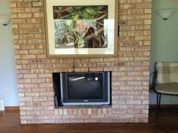 Floor To Ceiling Brick Fireplace With
