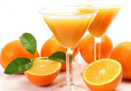 is drinking orange juice on an empty