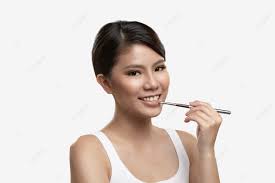 female asian applying lipgloss