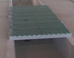 plastic slatted floor panels mounted on