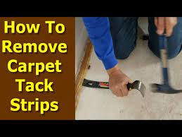 how to remove carpet tack strips from