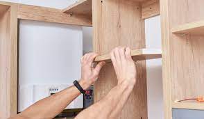 install new shelves inside cabinets