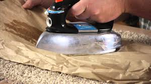 get candle wax out of wool carpet