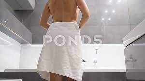 Woman entering the shower and dropping h... | Stock Video | Pond5