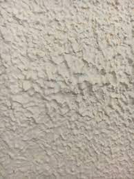 ugly popcorn textured paint on walls