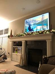 tv centered above the fireplace