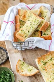This homemade garlic bread is perfectly garlicky, buttery, lightly cheesy, and delicious. Homemade Garlic Bread Spend With Pennies