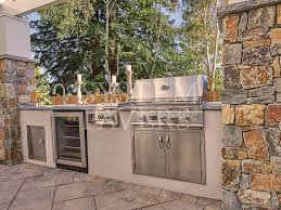 Extra thick limestone or flagstone slabs with hand chipped edges add to the detail work of our kitchen. Custom Designed Outdoor Kitchens System Pavers