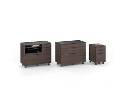 The precursor to our modern carousel storage systems can be seen in the cabinet at the left which combined pigeon hole, flat drawer files, bookcases and a revolving stand for easy access. Sigma 6907 Low Mobile File Cabinet Pedestal Bdi Furniture