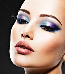 young woman with blue makeup