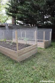 It can also be used to keep the chickens out of your flower or veggie garden. How To Build A Diy Raised Garden Bed And Protect It With A Metal Fence