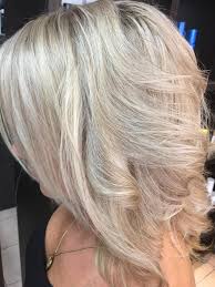 This look, featuring brown hair with blonde highlights, weaves the blonde in from all points on the head. Nahid S Hair Beauty Effect Of Lowlights In Very Blonde Hair Goldwell Facebook
