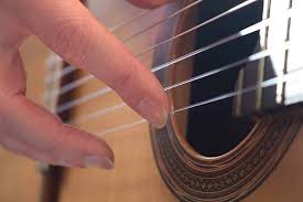 play electric guitar with long nails