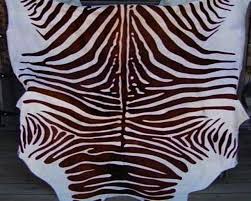 zebra cow hide rug dark brown on off
