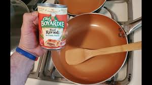 cook chef boyardee ravioli on the stove