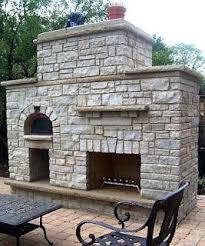 Beautiful outdoor fireplace with a pizza oven and bbq grill combo ina downtown portland home. Fireplace And Pizza Oven Large Outdoor Fireplace Pizza Oven Outdoor Fireplace Patio Outdoor Fireplace Designs