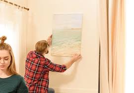 how to hang pictures on a slanted wall