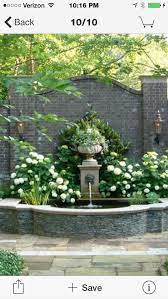Lions Head Fountain On Garden Wall