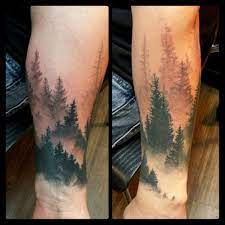 Frog tattoo also signifies peace, prosperity, good luck, opportunities, success, healing, abundance, wealth, mysteries, and regeneration. I Love The Colors And The Style Of These Foggy Pine Trees Hipster Tattoo Tattoos Nature Tattoo Sleeve