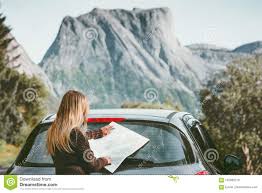 Woman Traveling By Car On Road Trip With Map Planning Route