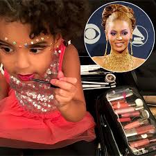 blue ivy playing with her makeup
