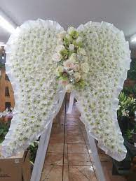 angel wings by bouquets and baskets