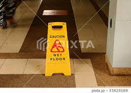 please walk slowly wet floorの写真素材