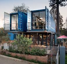 This shipping container home is open plan with plenty of glass to capture the outdoor views. Cafe Interior Designs Coffee Shop Container Cafe Design