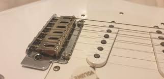block vs bent steel guitar saddles