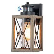 1 Light Black And Faux Wood Motion Sensor And Dusk To Dawn Outdoor Wall Sconce With Clear Seeded Glass