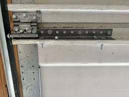 how to repair a garage door hinge