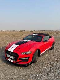 uae in a ford mustang convertible