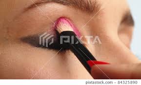 make up artist applies makeup to the